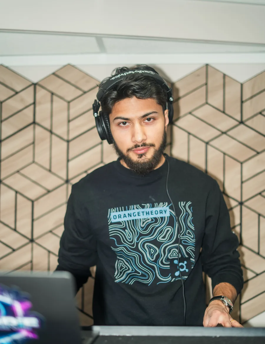 DJ Sarif — Sarif Subedi, headphones on, at the decks